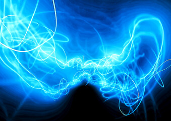Blue Energy Flow — Abstract Neon Light Motion Background.Abstract background of glowing blue light trails forming dynamic energy waves.