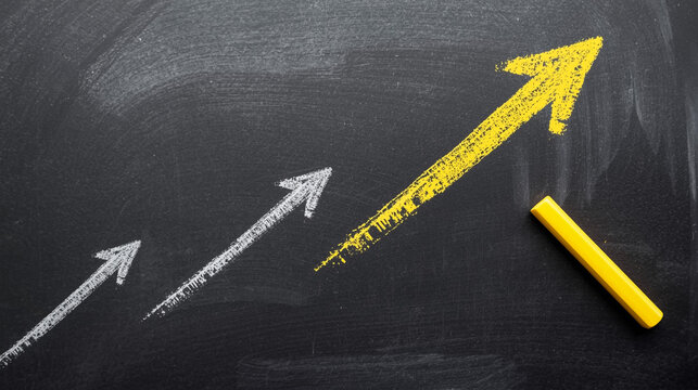 Growth chart on chalkboard with arrows showing business success and progress