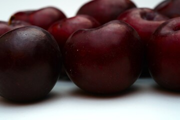 Fresh ripe red plums close-up for healthy eating
