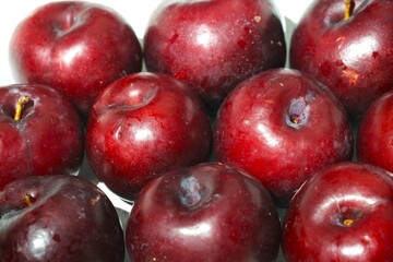 Fresh ripe red plums close-up for healthy eating
