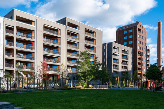 Urban park Bathusparken surrounded by modern residential architecture and green sustainable landscape in Norradjurgardsstaden, Stockholm, with eco vegetation and community design