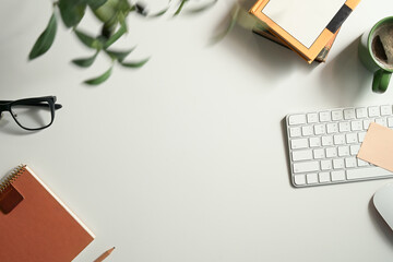 Minimalist top view workspace desk with computer, notebook, coffee