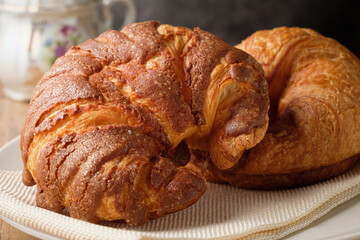 Fresh Croissants on Plate with Hot Ceramic Teapot
