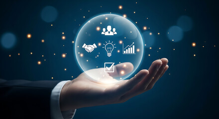 Hand holding a bubble containing icons representing business development, teamwork, idea generation and quality control.