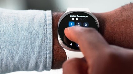 Man Trying To Unlock Smartwatch - Powered by Adobe