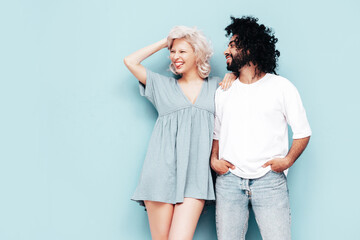 Smiling beautiful woman and her handsome boyfriend. Sexy cheerful multiracial family having tender...