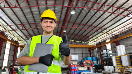 Construction worker giving thumbs up warehouse portrait industrial setting positive attitude