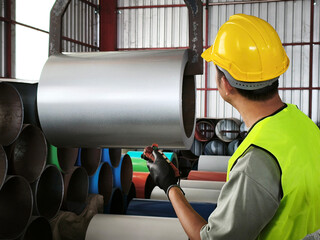 Manufacturing process of metal rolls factory floor industrial photography production environment worker perspective efficiency concept