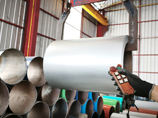 Controlling heavy machinery industrial warehouse photo indoor close-up view precision handling techniques