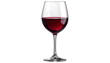 Crystal glass containing dark red wine on stark black background