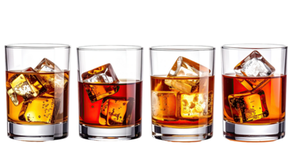 Four short glasses with amber liquid & ice