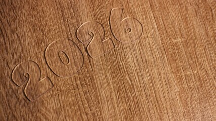 Transparent Acrylic 2026 Numbers on Wood Texture, Clear Plexiglass Date Typography, Rustic Background with Copy Space