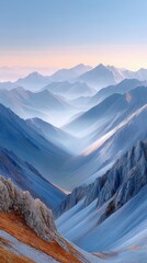 Layered Mountain Ranges Under a Soft Sky at Sunrise with Snow and Fog