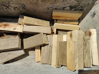 Pile of sawn wooden boards, logs. Harvesting firewood for winter. Close-up.