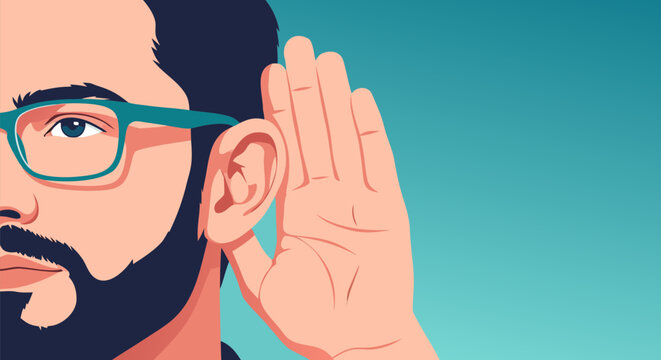 Attentive bearded man wearing glasses holds a hand to his ear to listen carefully, concept of communication and hearing