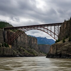 A view of the historic steel arch bridge over the fraser river in a canyon