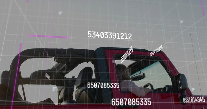 Overlaying numeric grid on red 4x4 vehicle with exposed rollcage outdoors, driver wearing light top