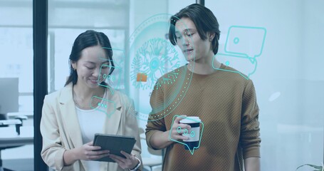 Viewing coworkers wearing formal attire using tablet and cup in office, with holographic AI display