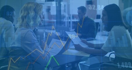 Exchanging printed charts corporate women analyzing data at conference table, with digital overlays
