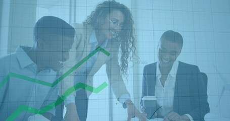 Smiling professionals pointing documents and holding coffee cup under graph overlay in meeting room
