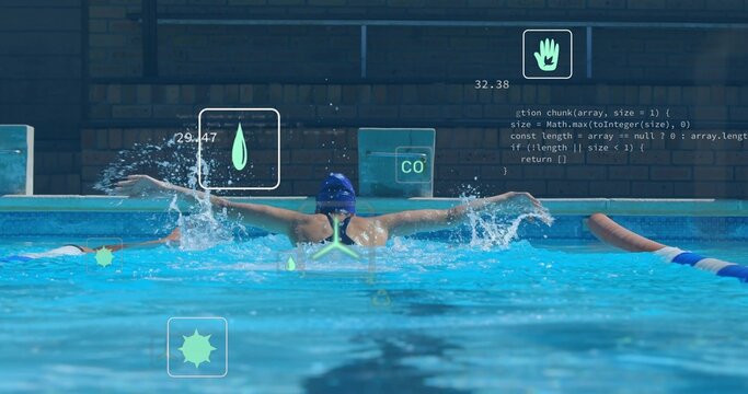 Executing butterfly stroke female swimmer propelling through pool lane with swim cap, goggles, HUD