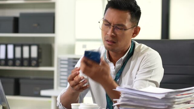 Male businessman talking on the phone arguing work problems  customer dissatisfaction.