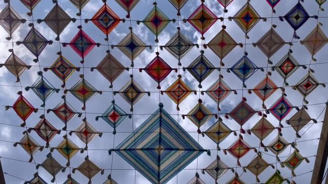 God's Eye - Ojo de Dios Installation Over The Street In Centro, Guadalajara, Jalisco, Mexico. - low angle shot