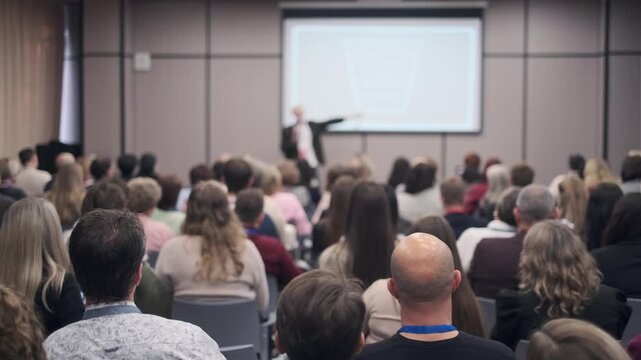 Training session focused on public speaking, people learning and practicing presentation skills.