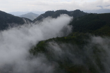 Aerial view of golden rice terraces at Mu Cang Chai town near Sapa city, North of Vietnam. Beautiful terraced rice field in harvest season in Yen Bai province.