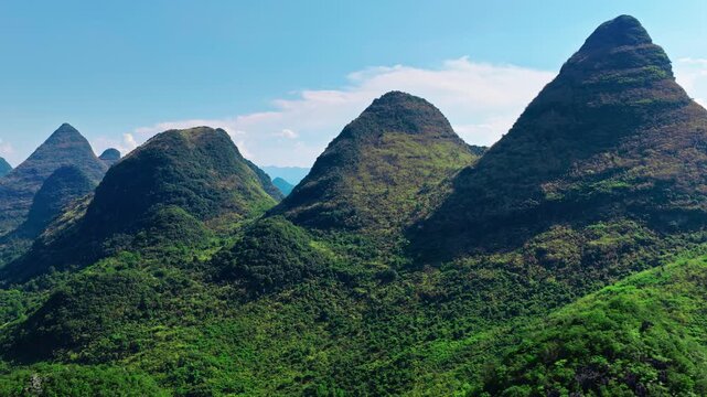 Aerial view of the iconic green karst mountain peaks on a clear day in southern China.