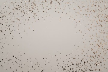 Celebrate with festive gold confetti stars and sprinkles on neutral background ready for party invites or elegant promotions this season