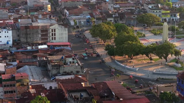 Aerial perspective over the Plaza 28 de Julio square and the city of Iquitos in Peru, showing old buildings and street traffic