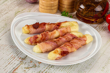 Hot mozzarella sticks with bacon