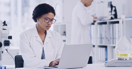 Scientist, woman or research in lab with laptop for experiment results, medical innovation or...