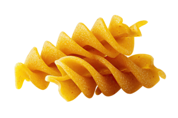 Close-up of golden spiral-shaped pasta with tiny red flecks