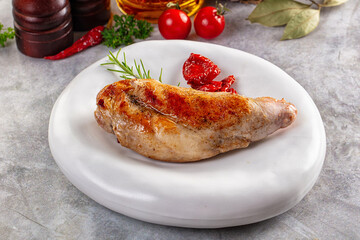 Roasted rabbit leg served rosemary