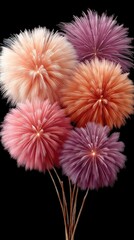 Vibrant Fireworks Display Illuminating the Night Sky in a Celebration of Light and Color with Pink Orange and Purple Hues Against a Deep Black Background