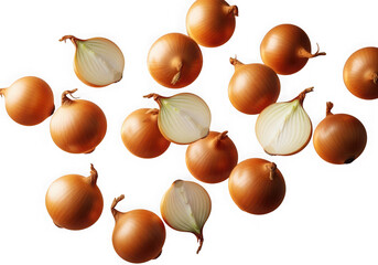 Fresh whole and halved yellow onions scattered organic food ingredients isolated on transparent background