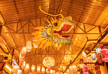A dragon-shaped lantern hanging from the roof