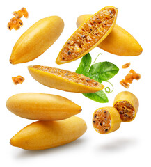 Curubas or banana passion fruits and fruit slices levitating in air on white background. File contains clipping paths.