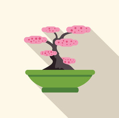 Pink flowers blooming on a miniature bonsai tree, showcasing the art of bonsai cultivation