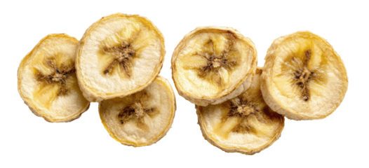 Close-up of sliced dehydrated banana pieces against a black backdrop