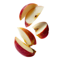 Sliced red apple pieces suspended in mid-air