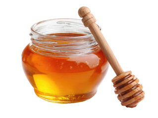 Glass jar with golden honey and wooden dipper