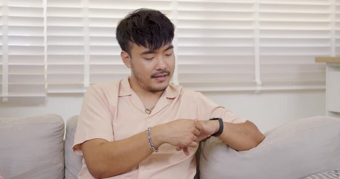 asian man sit on sofa sharing personal feelings during therapy session with senior asian therapist, expressing emotion and self awareness through open conversation at mental health clinic