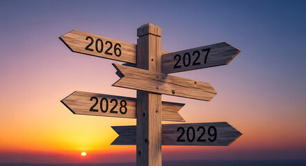 A wooden signpost with arrows for the years 2026 to 2029 representing future choices