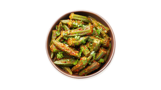 A delicious bowl of spicy Indian okra fry garnished with fresh cilantro leaves shown from a top-down view against a white background
