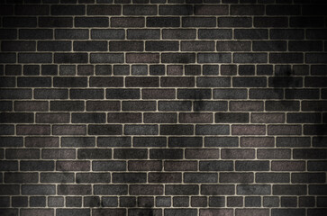 Dark red brick wall texture of an old building with a seamless construction pattern
