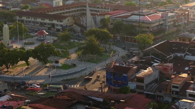 Aerial view of Plaza 28 de Julio, one of the main squares in Iquitos, Peru, with monuments, buildings, and city traffic
