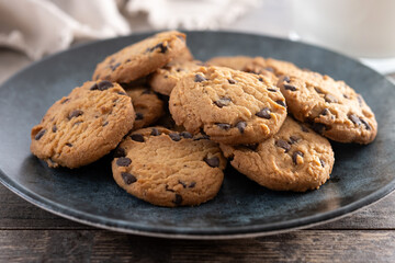 Chocolate chip cookies for breakfast on wooden table